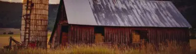 Morning sunrise over an old barn