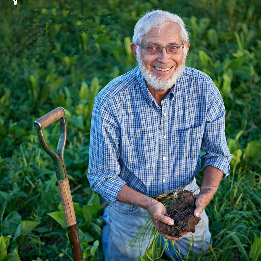 David Vetter holding soil