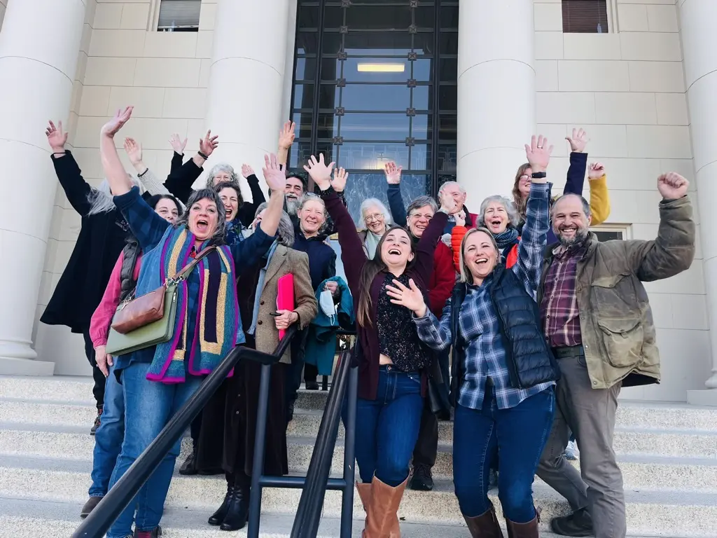People celebrating in front of building
