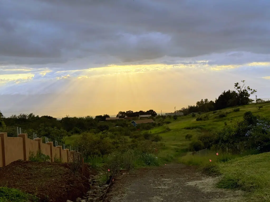 landscape in hawaii with sun coming through clouds