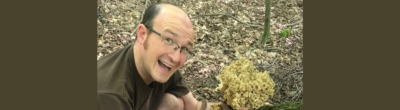 man harvesting a mushroom