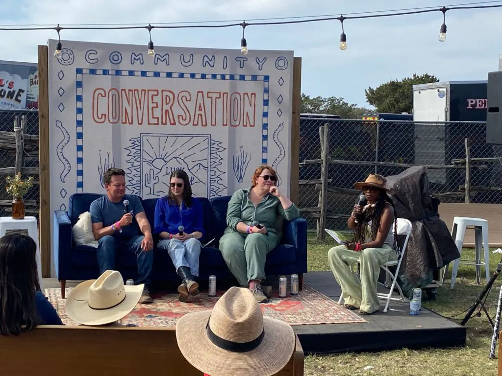 people on a stage recording