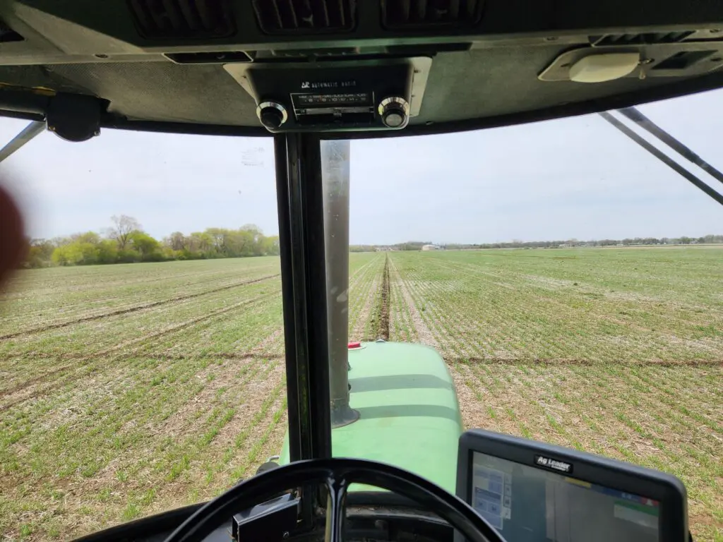 The view from John's cab while he plants a cereal rye cover crop to prevent soil erosion, use less fertilizer and increase wildlife habitats.