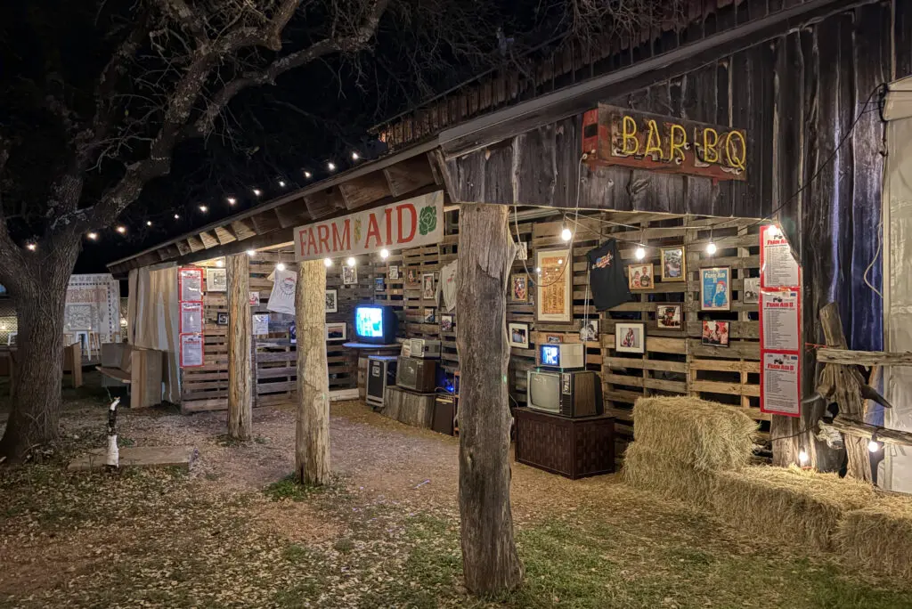 display of vintage posters and televisions playing old footage