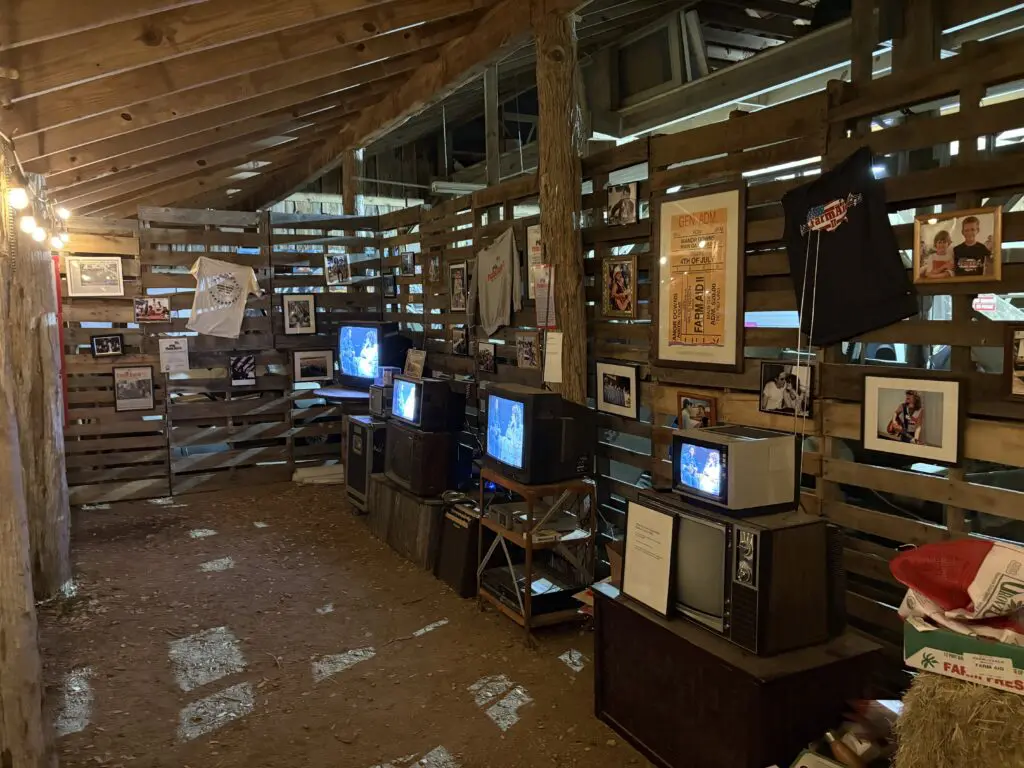 display of vintage posters and televisions playing old footage