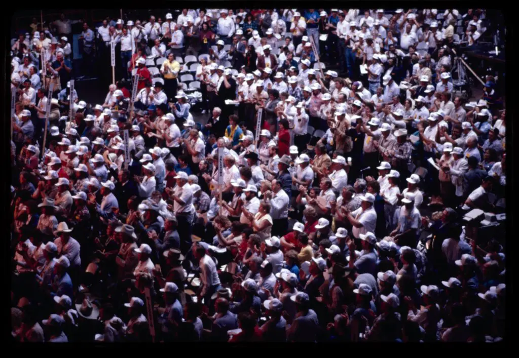 crowd in white caps