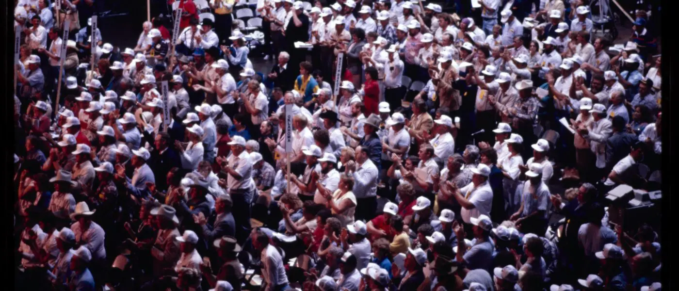crowd in white caps