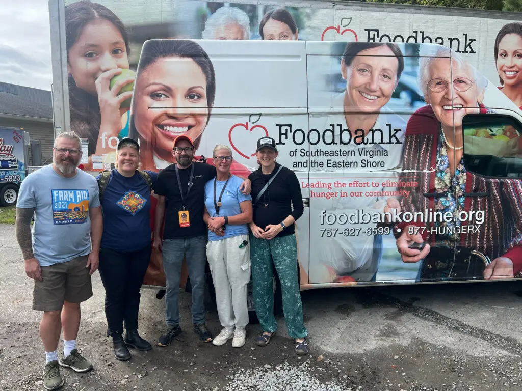 Farm Aid staff with Southeast Virginia Foodbank staff and truck
