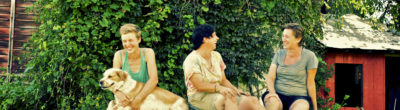 Women farmers sitting on a tractor