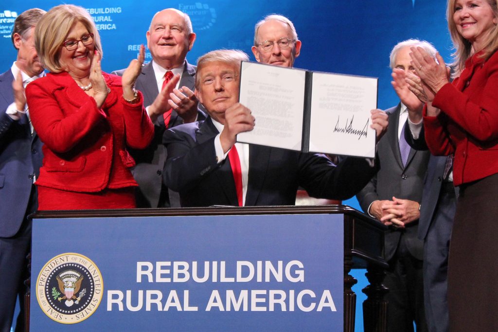 U.S. Secretary of Agriculture Sonny Perdue ceremonially presents the findings of the Interagency Task Force on Agriculture and Rural Prosperity to President Donald J. Trump at the 2018 American Farm Bureau Annual Convention in Nashville, Tennessee, January 8, 2018.