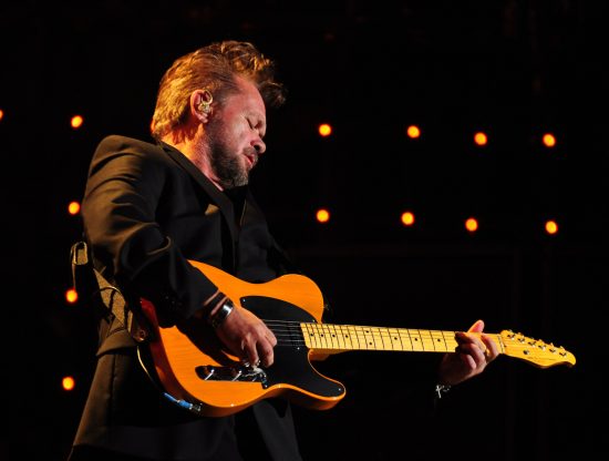 John Mellencamp playing guitar