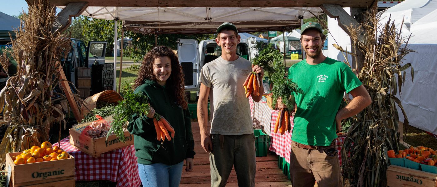 Farmer Kev (right) at his farm stand in Maine.