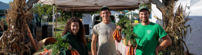 Farmer Kev (right) at his farm stand in Maine.