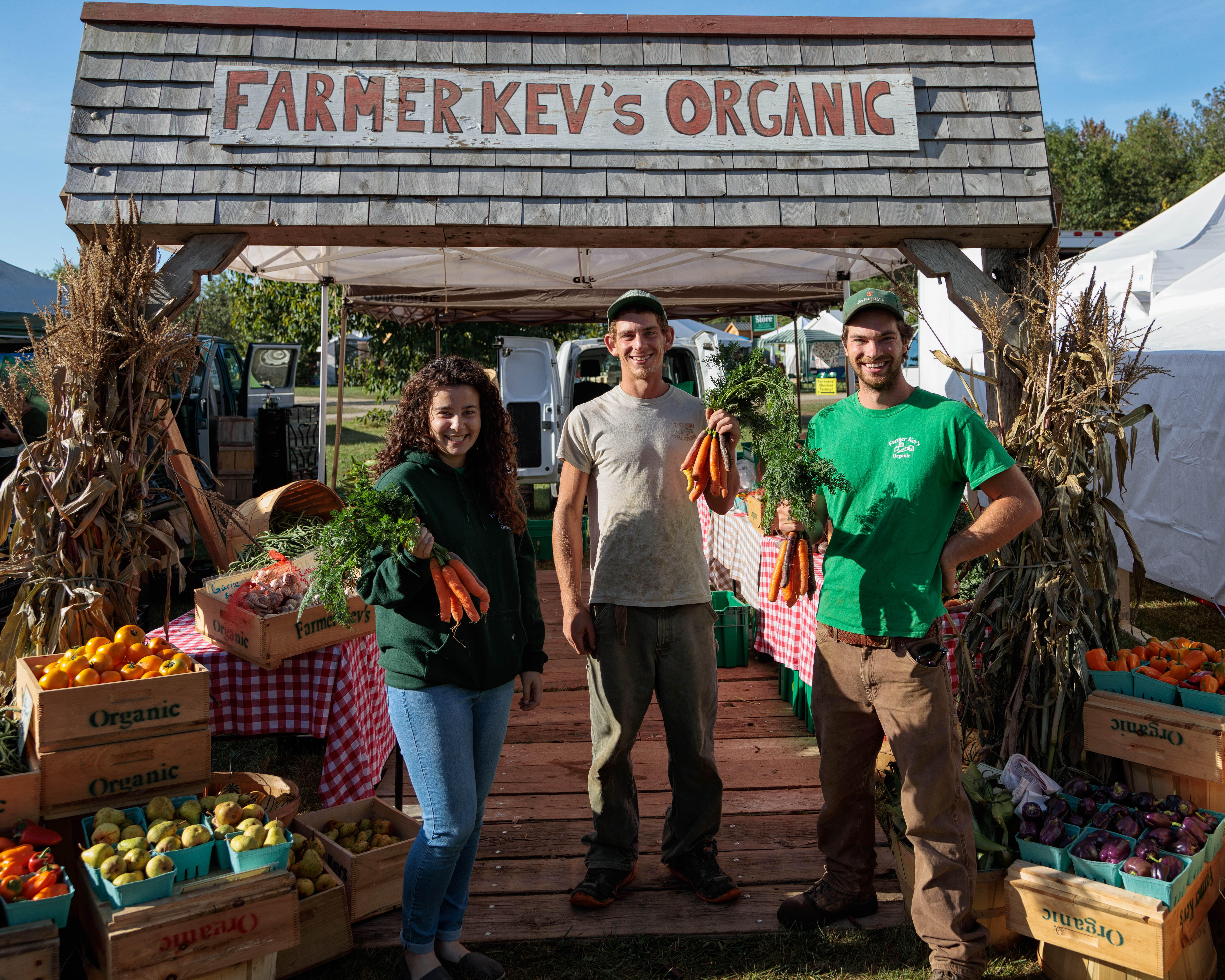 Farmer Kev (right) at his farm stand in Maine.