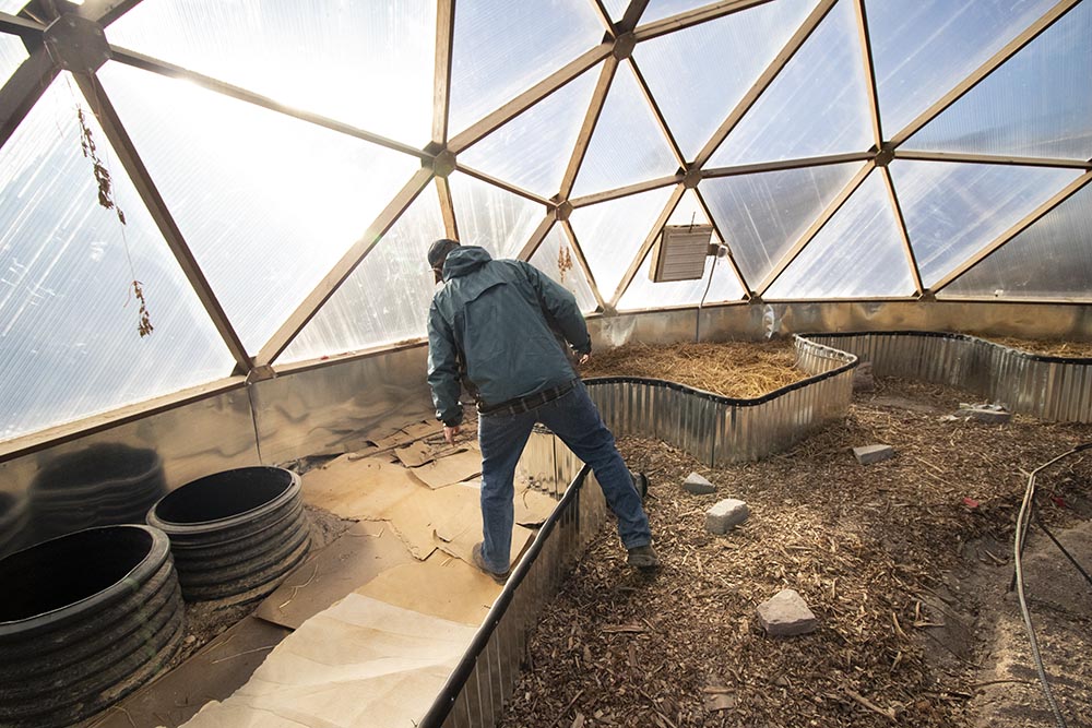 Mike Prate inside the Keya Wakpala Garden’s greenhouse.