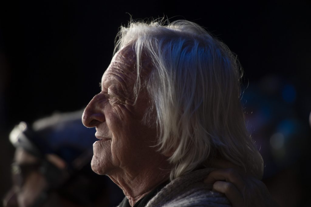 Elliot Roberts watches Neil Young on stage