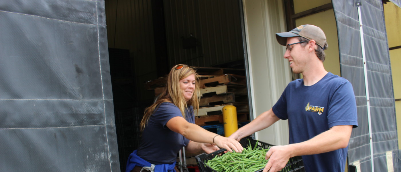 Sarah and Kyle share the load of fresh-picked green beans