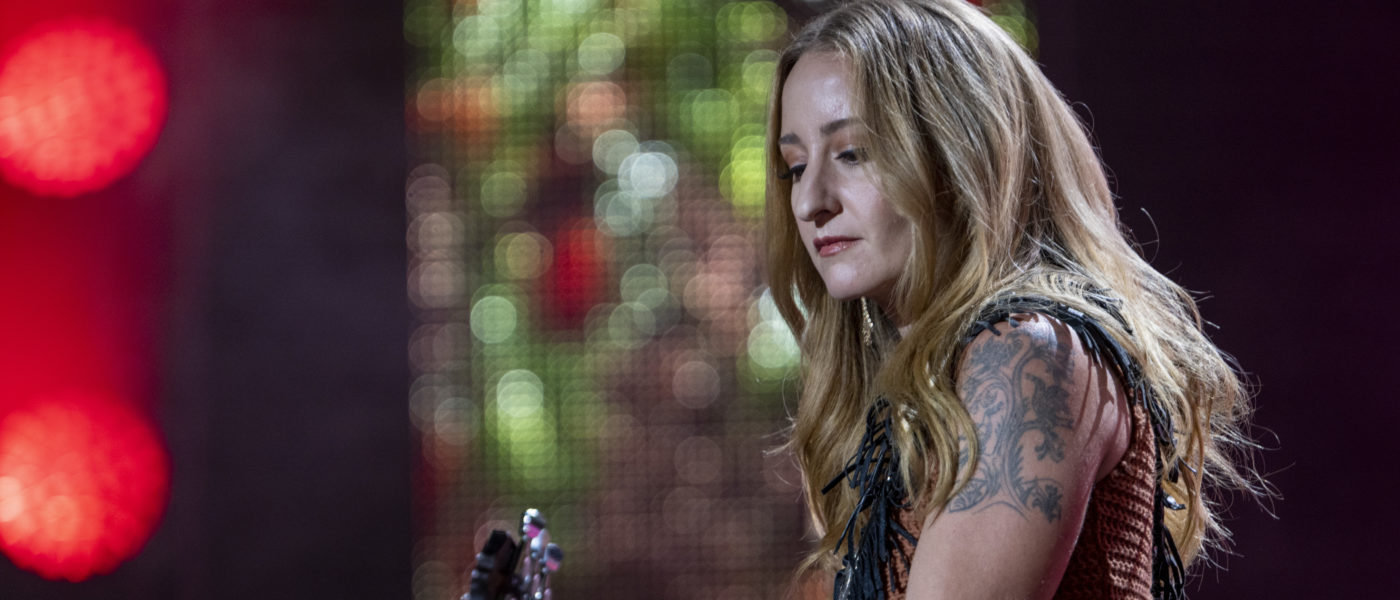 Margo Price plays guitar on the Farm Aid 2022 stage