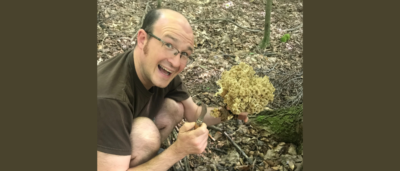 man harvesting a mushroom