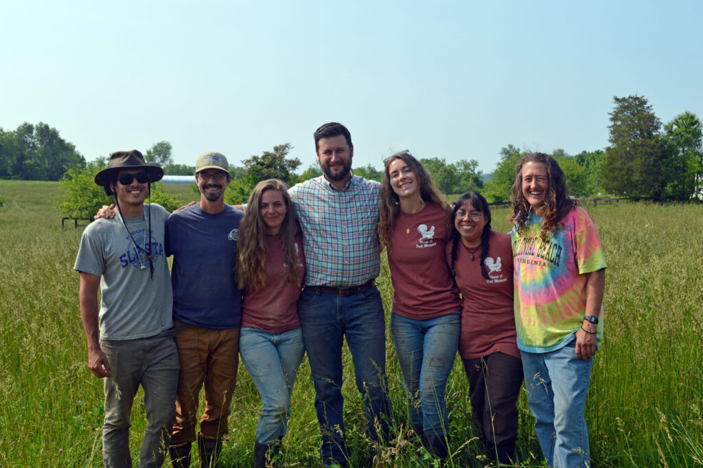 farmworkers in a field posing for a portrait