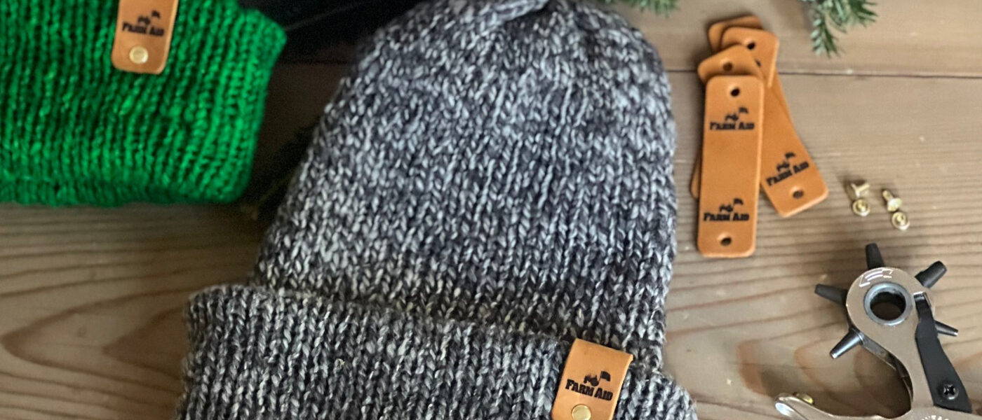 FARM AID wool hats on a table